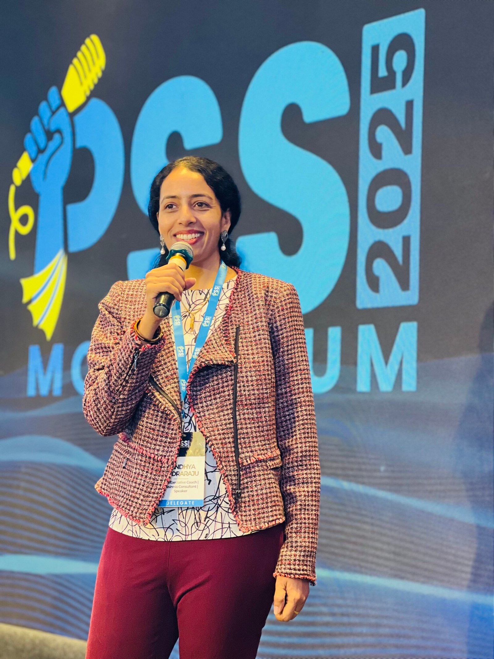 Sandhya Rudraraju speaking on stage