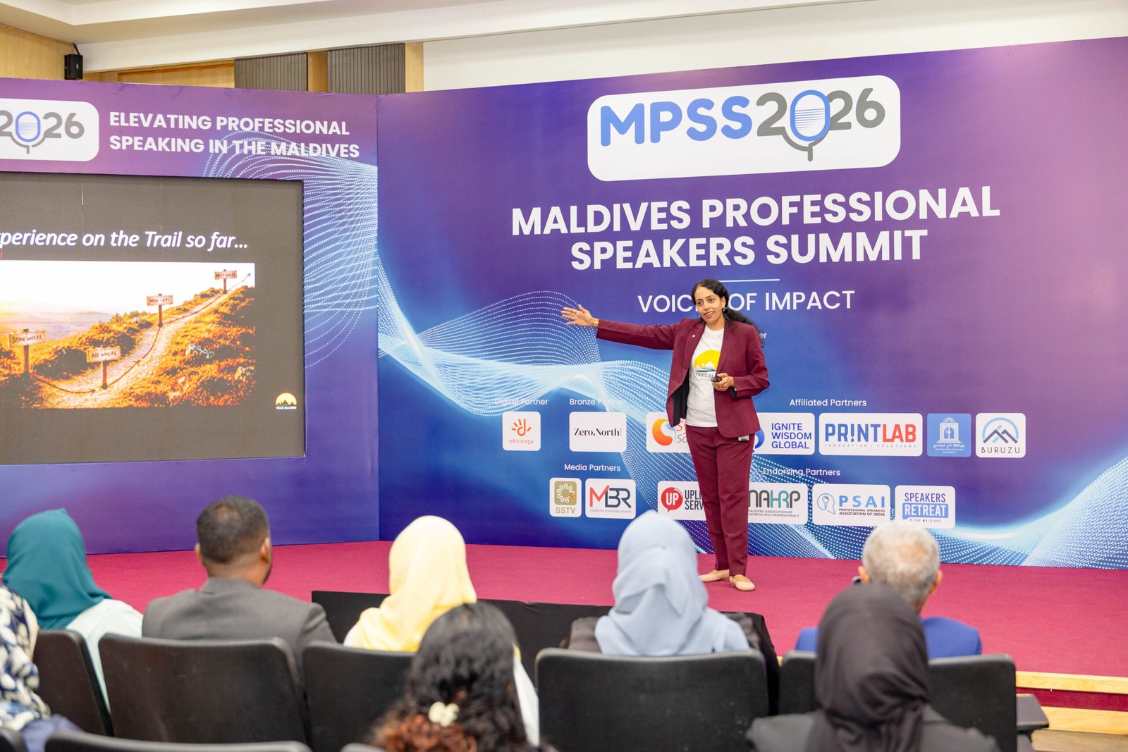 Sandhya Rudraraju speaking on stage