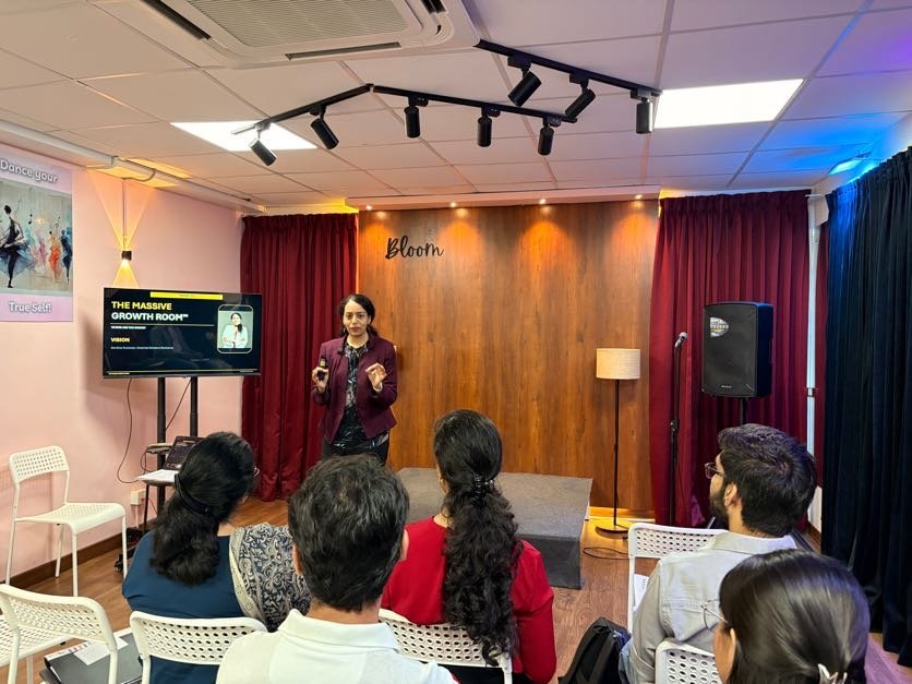 Sandhya Rudraraju speaking on stage